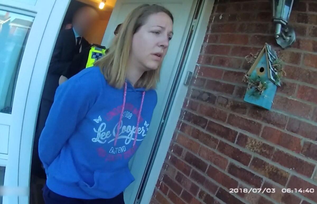 A handout image taken from police bodycam footage released by Cheshire Constabulary police force in Manchester on August 17, 2023, shows the nurse Lucy Letby being arrested at home in Chester on July 3, 2018. — AFP