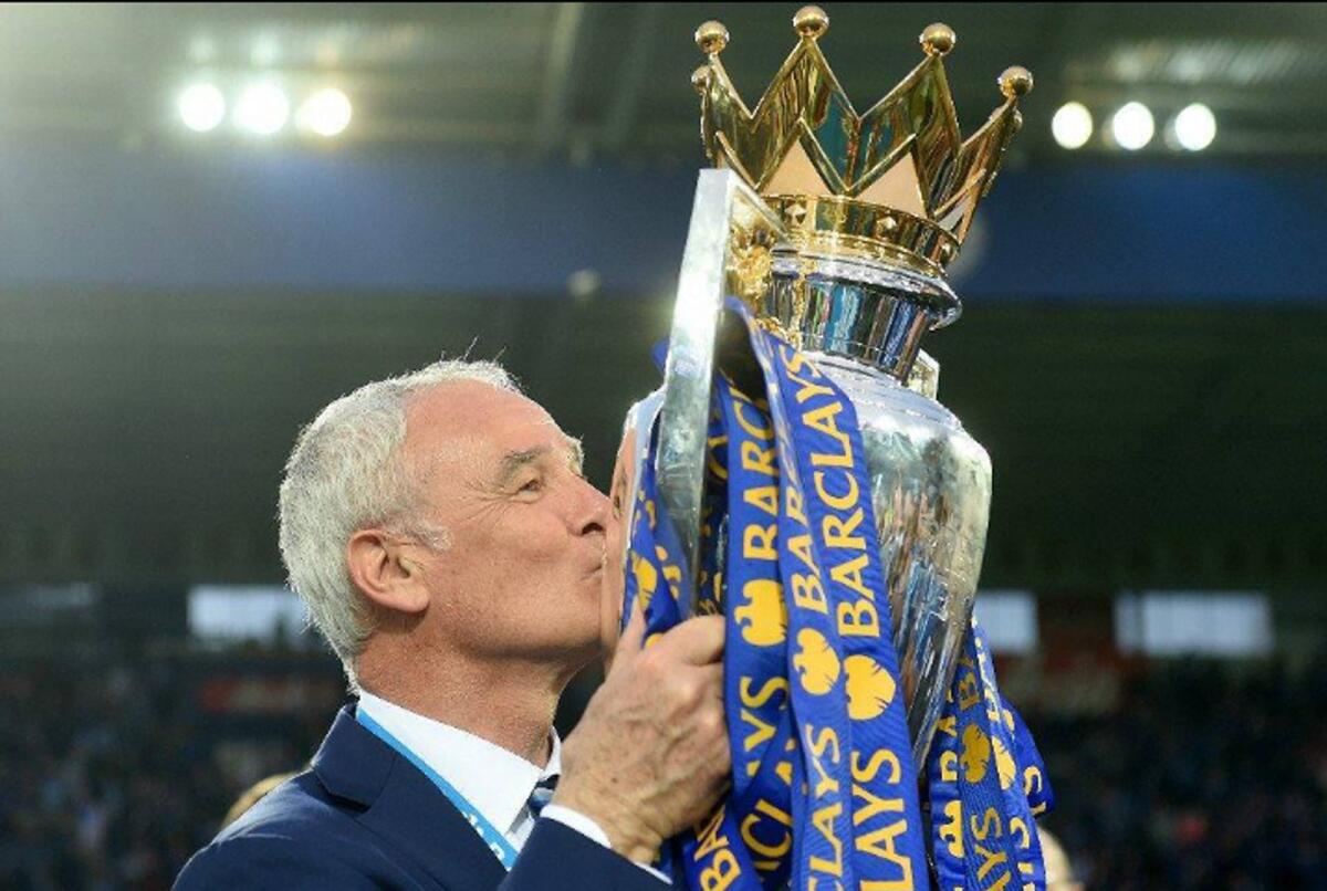 Famed Italian coach Claudio Ranieri kisses the trophy after Leicester City shocked the football world to win the Premier League title in the 2015/16 season. - Instagram