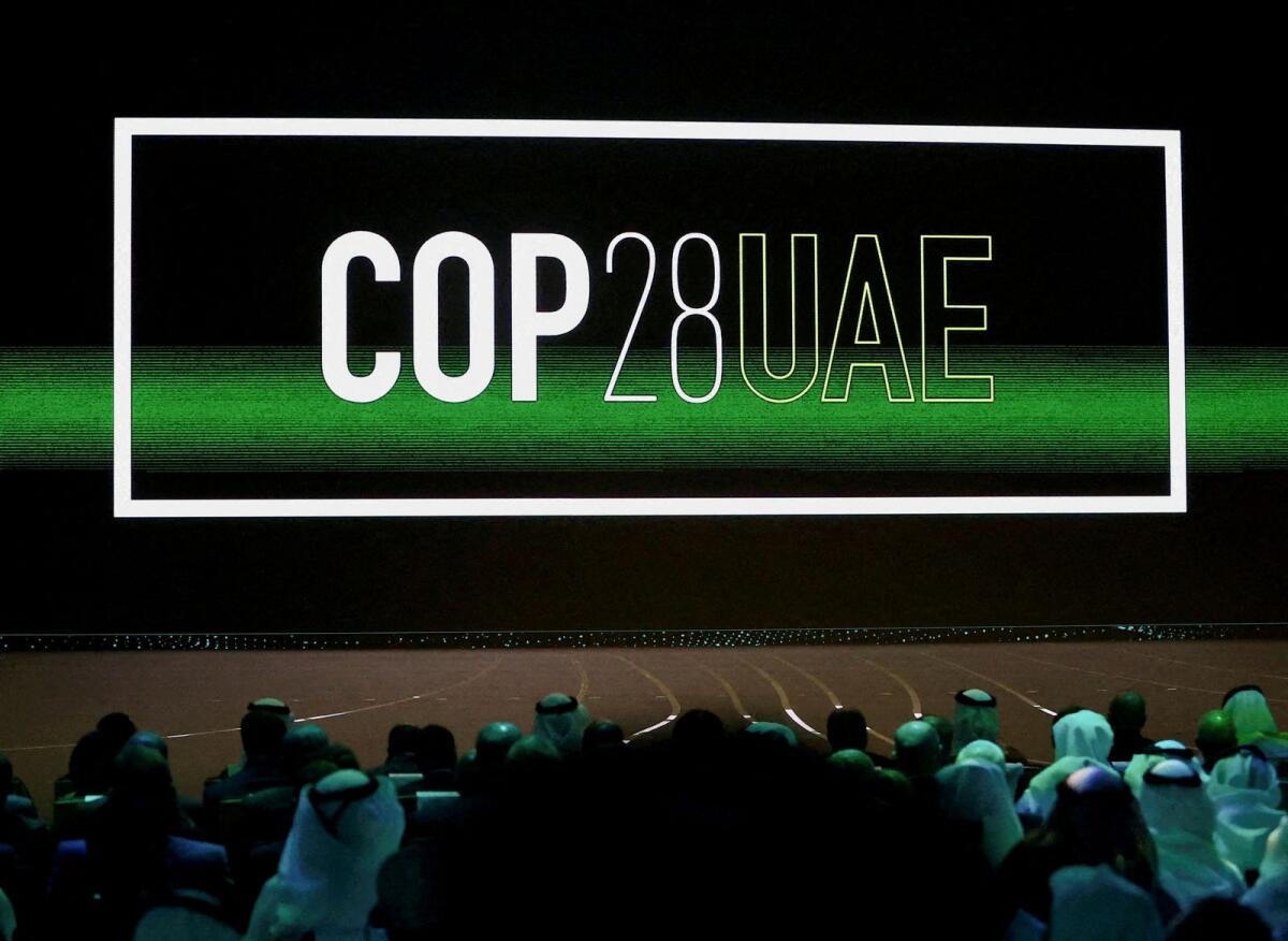 'Cop28 UAE' logo is displayed on the screen during the opening ceremony of Abu Dhabi Sustainability Week under the theme of 'United on Climate Action Toward COP28', in Abu Dhabi, UAE, on January 16, 2023. — Reuters file