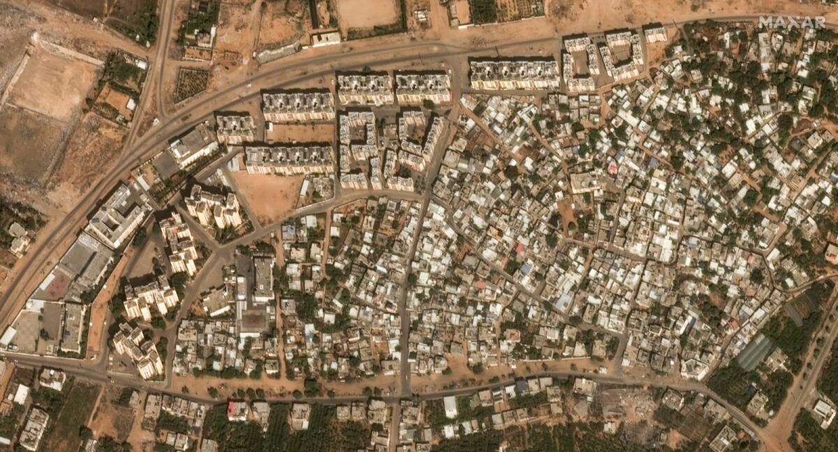 This image provided by Maxar Technologies shows before significant damage in the Izbat Beit Hanoun neighborhood, in northern Gaza, on October 10, 2023. — AP
