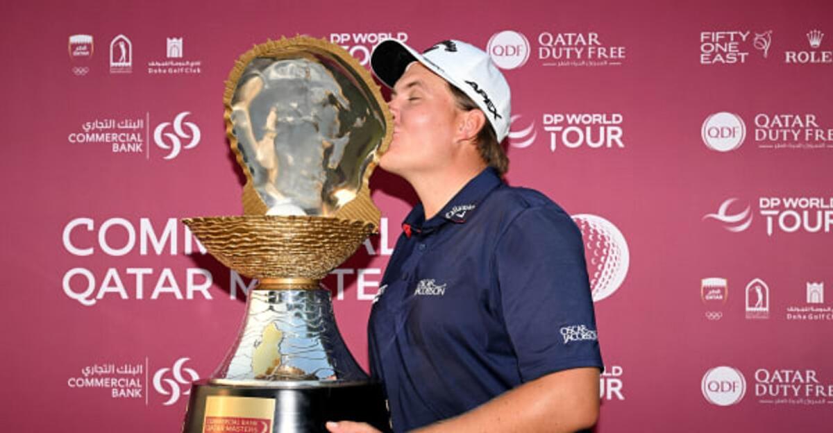 Sami Valimaki (Finland) celebrates with the Commercial Bank Qatar Masters Trophy. - Supplied photo