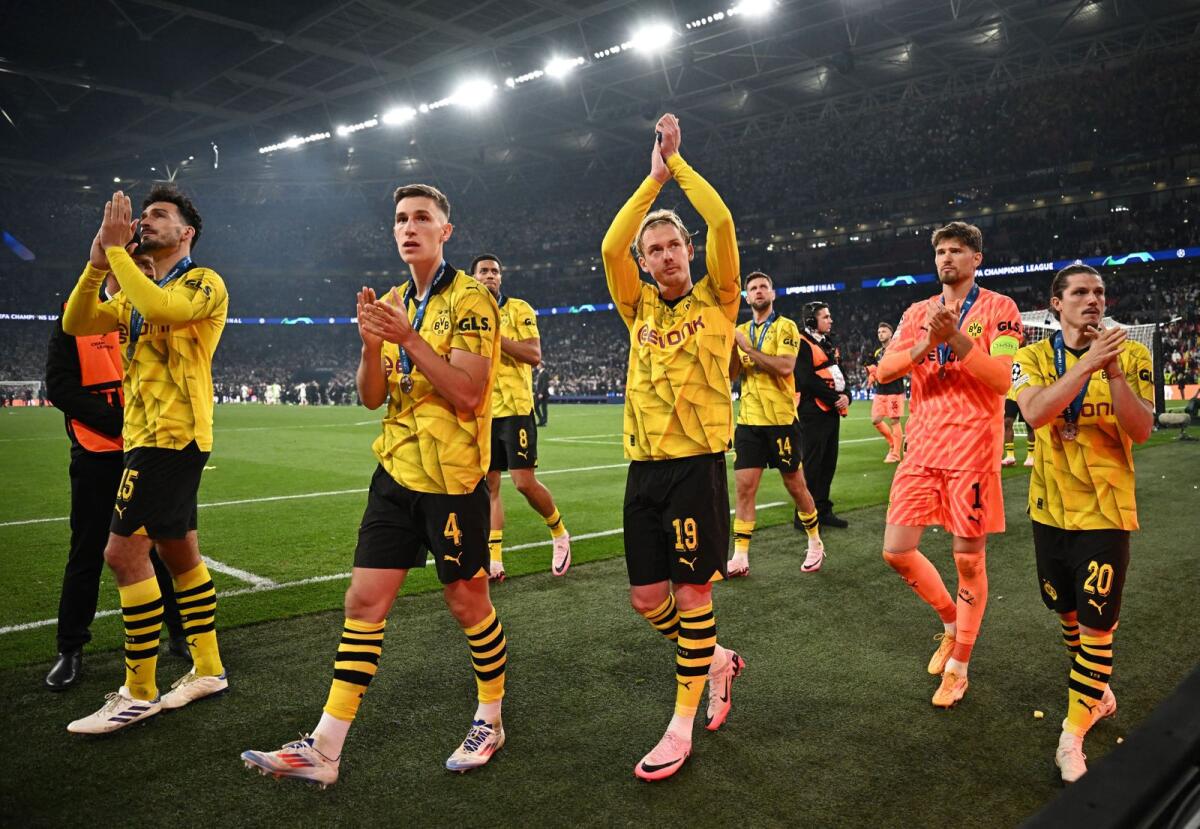 Borussia Dortmund's Mats Hummels, Nico Schlotterbeck, Julian Brandt, Gregor Kobel and Marcel Sabitzer acknowledge the fans. — Reuters