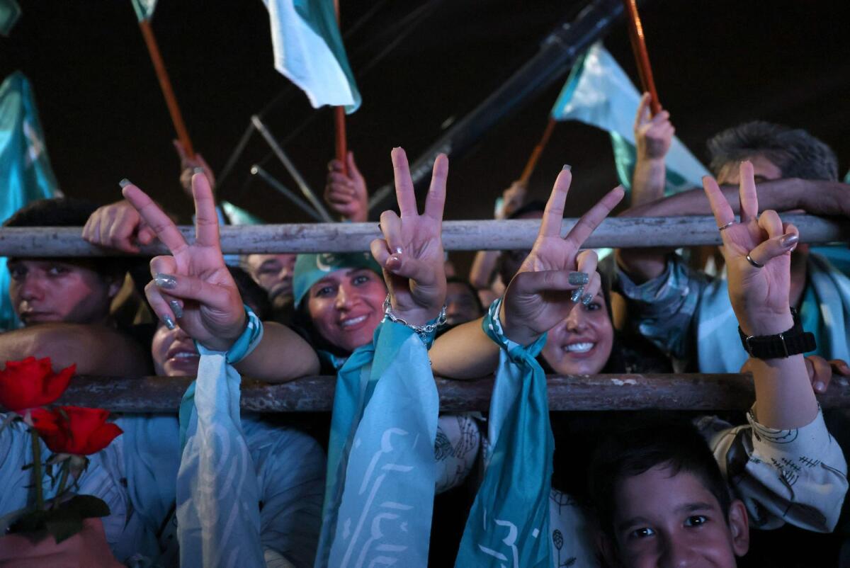 Women cheer during a campaign rally of Iranian reformist candidate Masoud Pezeshkian, two days before a presidential election runoff  in Tehran on July 3, 2024. -- AFP