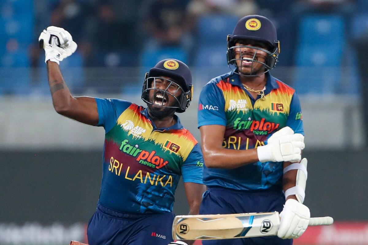 Sri Lanka's Asitha Fernando (left) and Maheesh Theekshana celebrate their win. (AFP)
