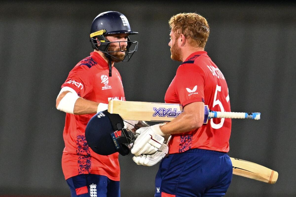 England's Phil Salt (left) and Jonathan Bairstow celebrate after winning the match. — AFP