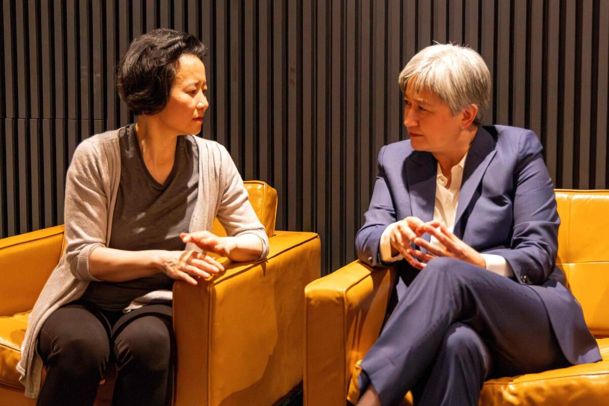 Australian Foreign Minister Penny Wong speaking with Australian journalist Cheng Lei upon her arrival at the airport in Melbourne.  – AFP