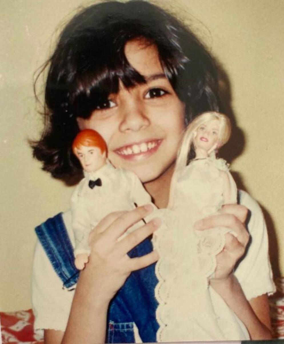 A gleeful Raneem with her Barbie dressed a bride along with Ken