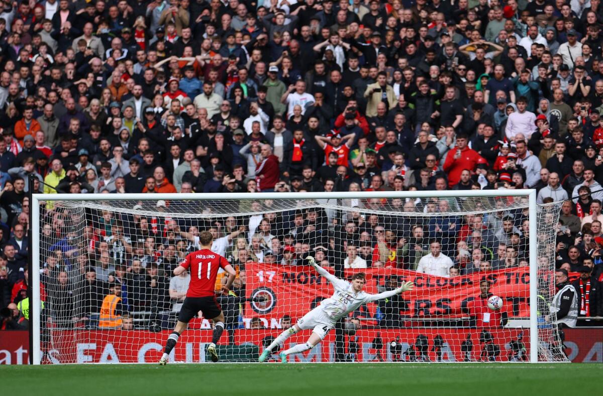 Manchester United's Rasmus Hojlund scores the decisive penalty. — Reuters