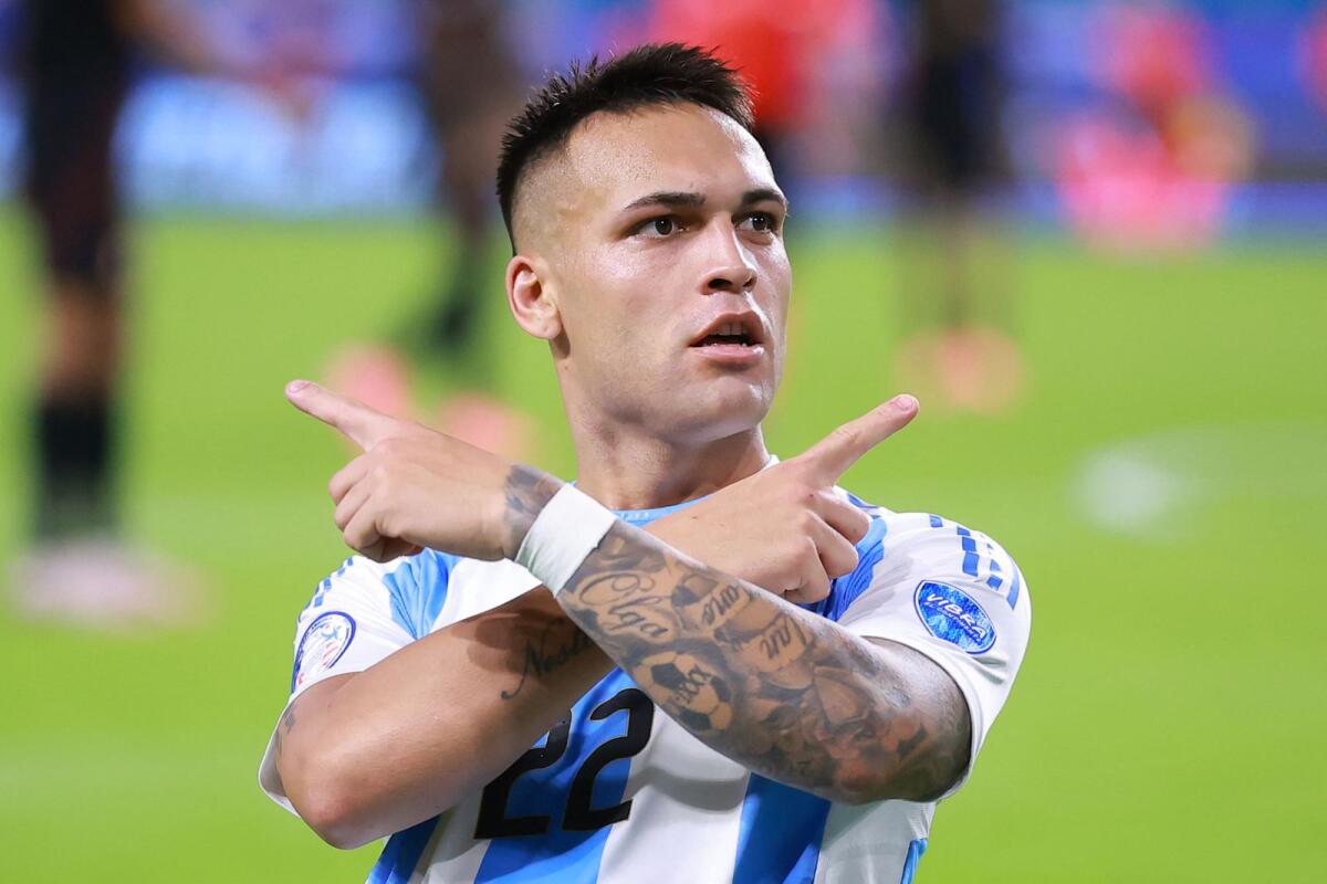 Lautaro Martinez of Argentina celebrates after scoring the team's first goal against Peru. — AFP