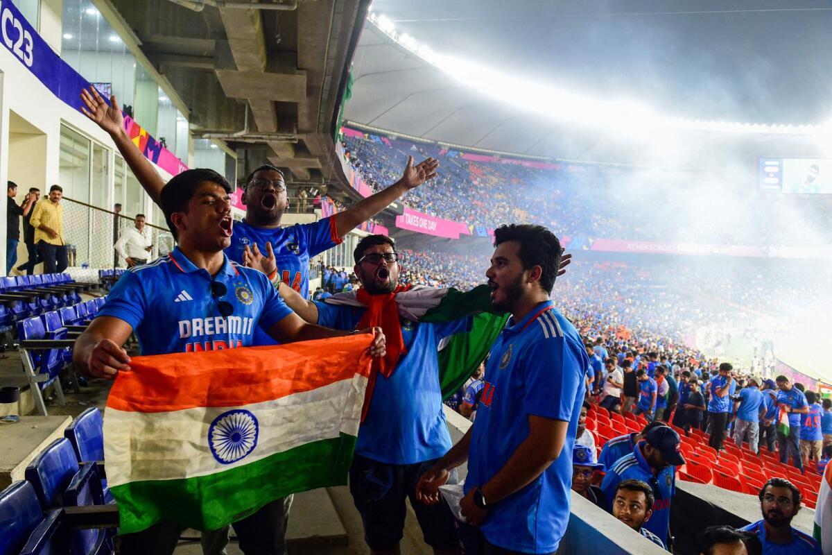 Cricket fans celebrate India's win over Pakistan. — AFP