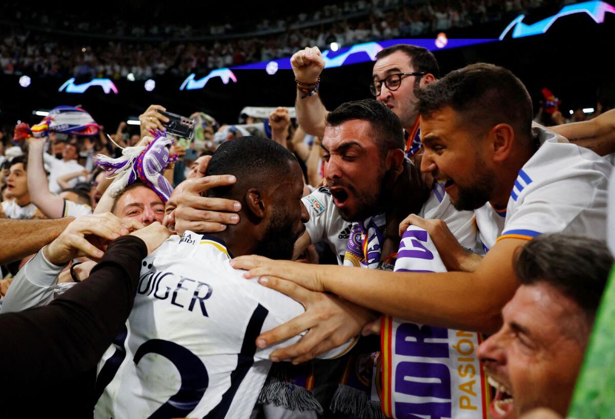 Real Madrid's Antonio Rudiger celebrates with fans after Joselu scores their second goal. — Reuters