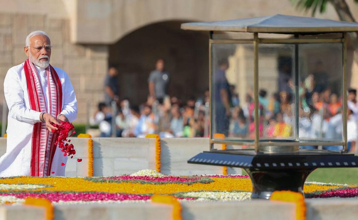 Narendra Modi pays floral tributes to Mahatma Gandhi at the Rajghat in New Delhi, ahead of his swearing-in as prime minister for a third term, on Sunday. Photo: AFP