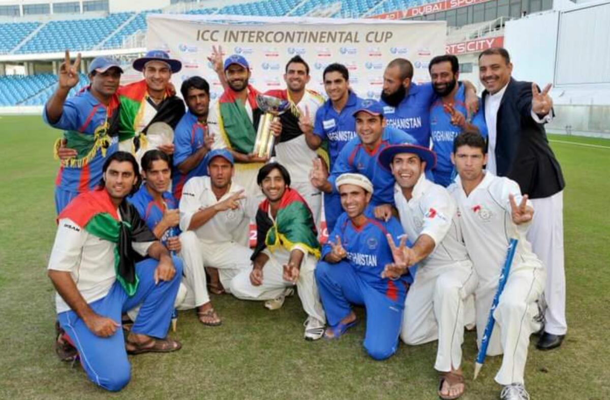 Rashid Latif (left) with the Afghan team after they won the ICC Intercontinental Cup in 2010 at the Dubai International Stadium. — Supplied photo