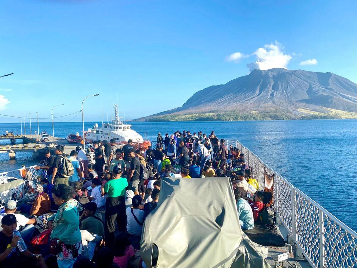 Residents of Tagulandang Island being evacuated by a navy ship after Mount Ruang volcano erupted in Sitaro, North Sulawesi. — AFP