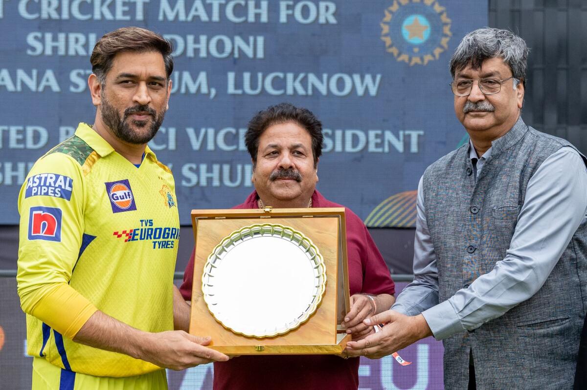 MS Dhoni felicitated by Rajeev Shukla, BCCI vice president in Lucknow on Wednesday. — IPL