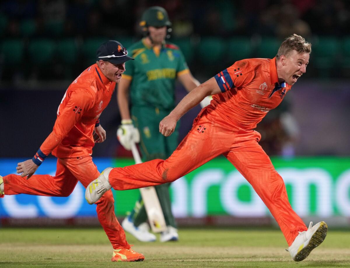 Netherlands' Logan van Beek celebrates after taking the wicket of South Africa's David Miller during the match in Dharamshala. — PTI