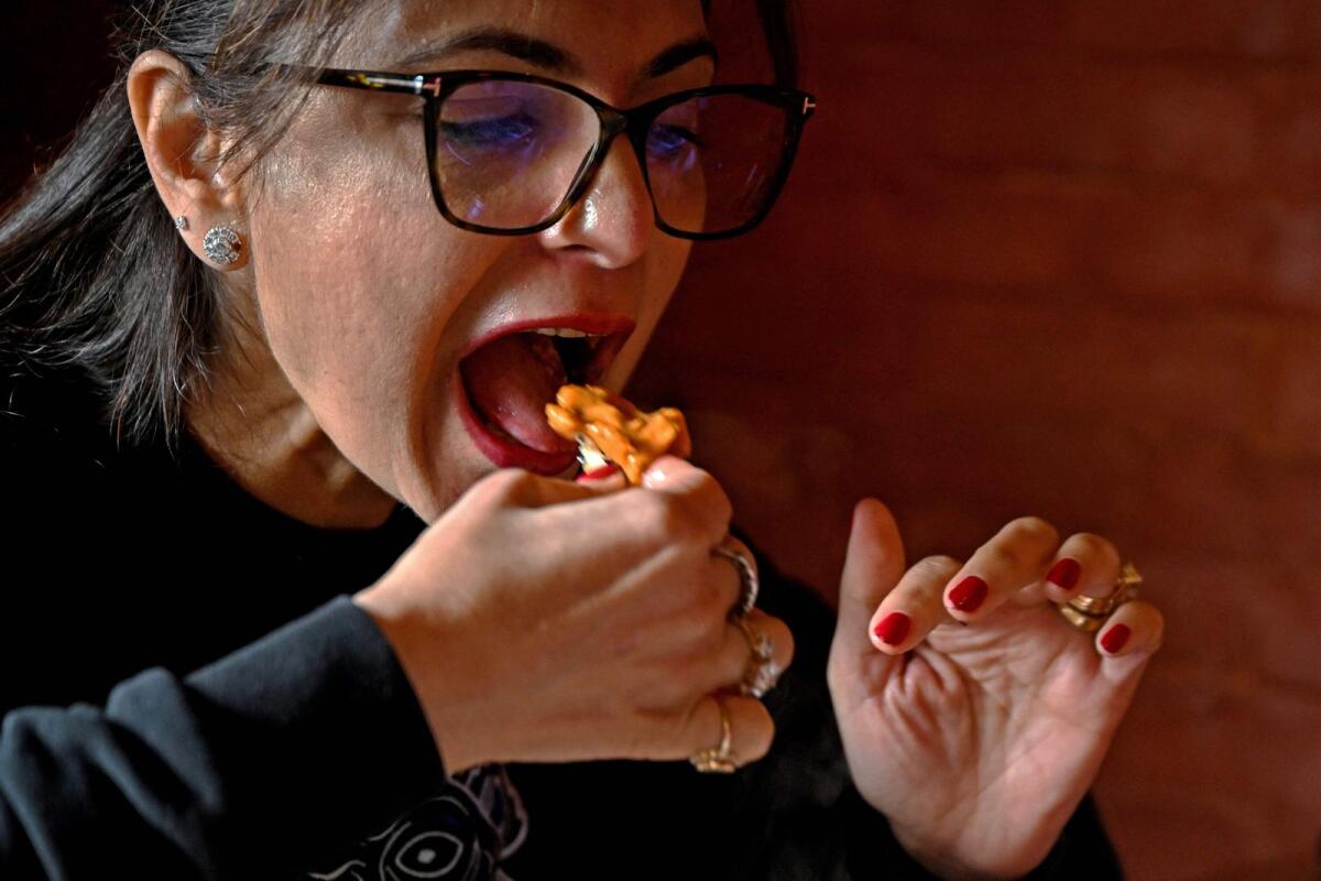 Rubina Kapoor eats butter chicken at the Moti Mahal restaurant. Photo: AFP file