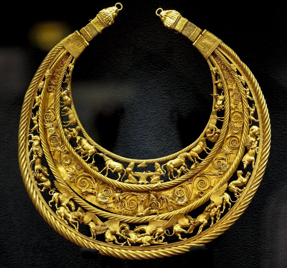 The fourth century B.C. golden pectoral, an ancient treasure from a Scythian king's burial mound, is exhibited in the Museum of Historical Treasures in Kyiv, Ukraine, on July 30, 2021. Fearing Russian troops would storm the city, museum employees dismantled exhibits, carefully packing away artifacts into boxes for evacuation. For now, the museum is just showing copies.