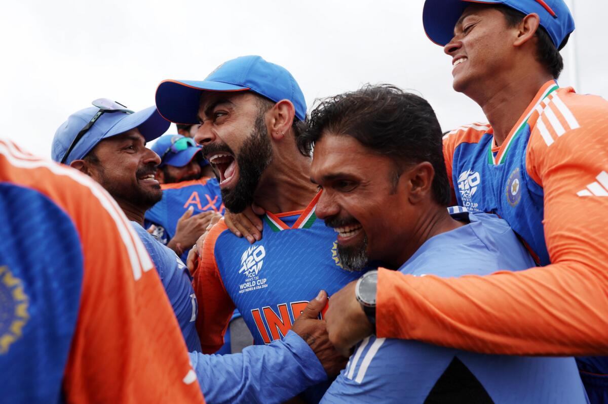 Kohli and members of the Indian team celebrate. — X