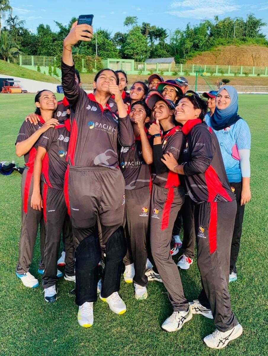 Mahika Gaur (centre) is seen taking a selfie with captain Chaya Mughal (right) and other teammates after UAE won a match. — Supplied photo