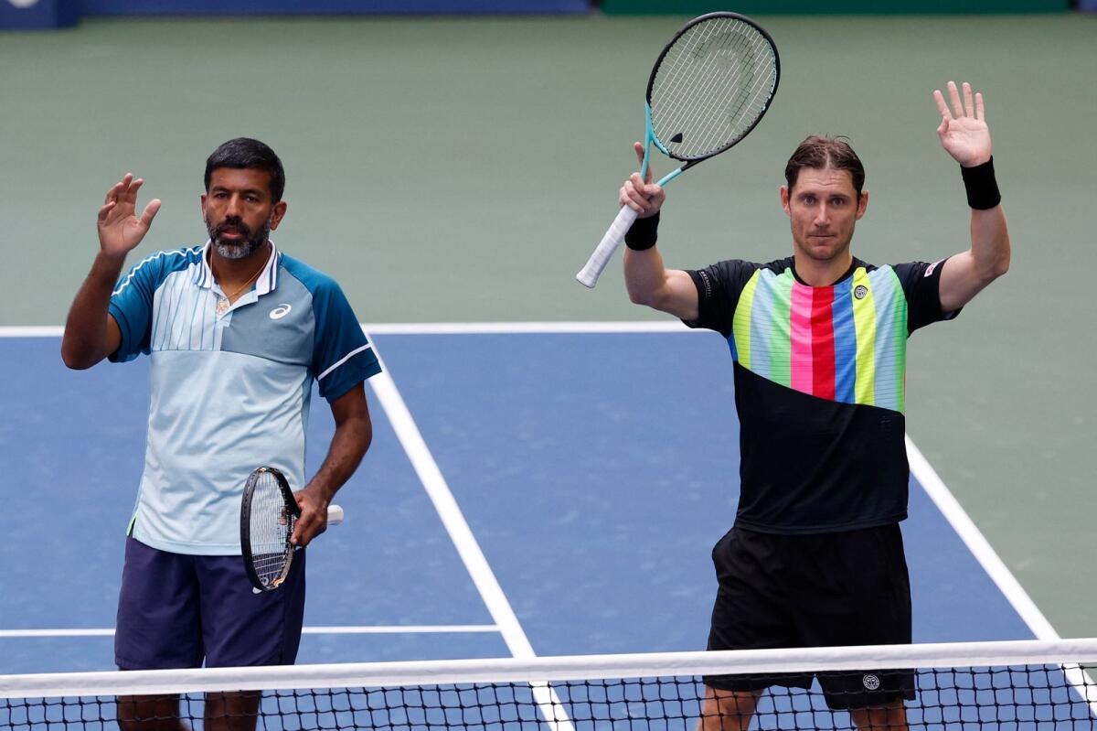 Rohan Bopanna of India and Matthew Ebden of Australia wave to the crowd after their victory over Nicolas Mahut and Pierre-Hugues Herbert of France.- USA TODAY Sports