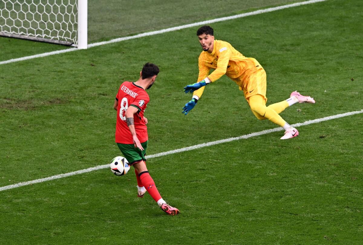 Portugal's Bruno Fernandes scores their third goal past Turkey's Altay Bayindir. — Reuters