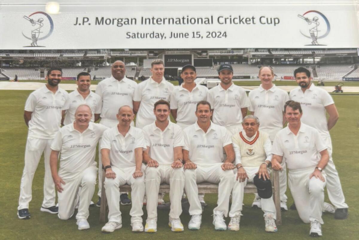 Sidhwa (second right, front row) poses with members of the team which was led by Stuart Broad