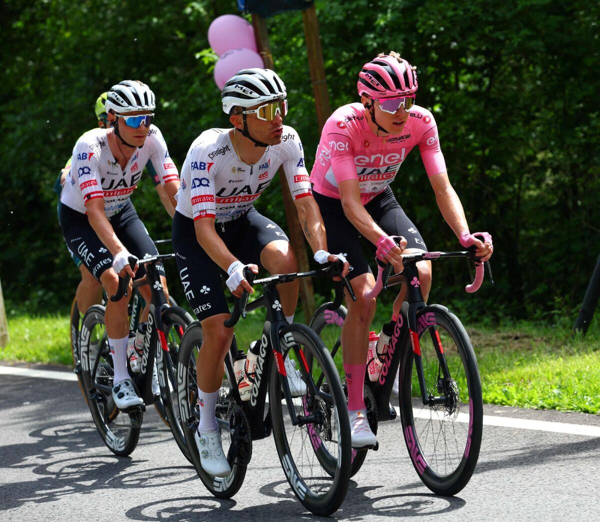 Team UAE's Slovenian rider Tadej Pogacar and Team UAE's Polish rider Rafal Majka rides during the 19th stage of the 107th Giro d'Italia cycling race on May 24. - AFP