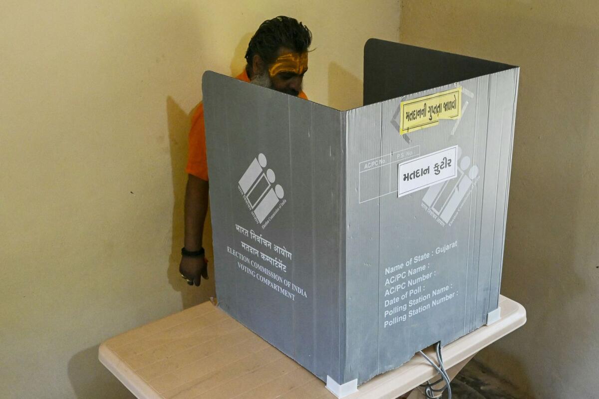 Hindu monk Mahant Haridas Udaseen, the sole registered voter at a polling station situated inside Gir Forest, casts his ballot during the third phase of voting of India’s general elections in Banej, Gujarat State, on May 7, 2024. — AFP
