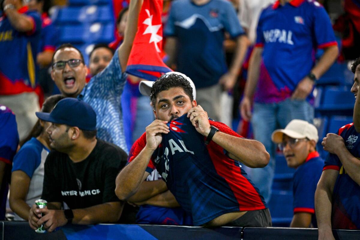 Nepal supporters cheer for their team after the match against Sri Lanka was abandoned due to weather conditions. — AFP
