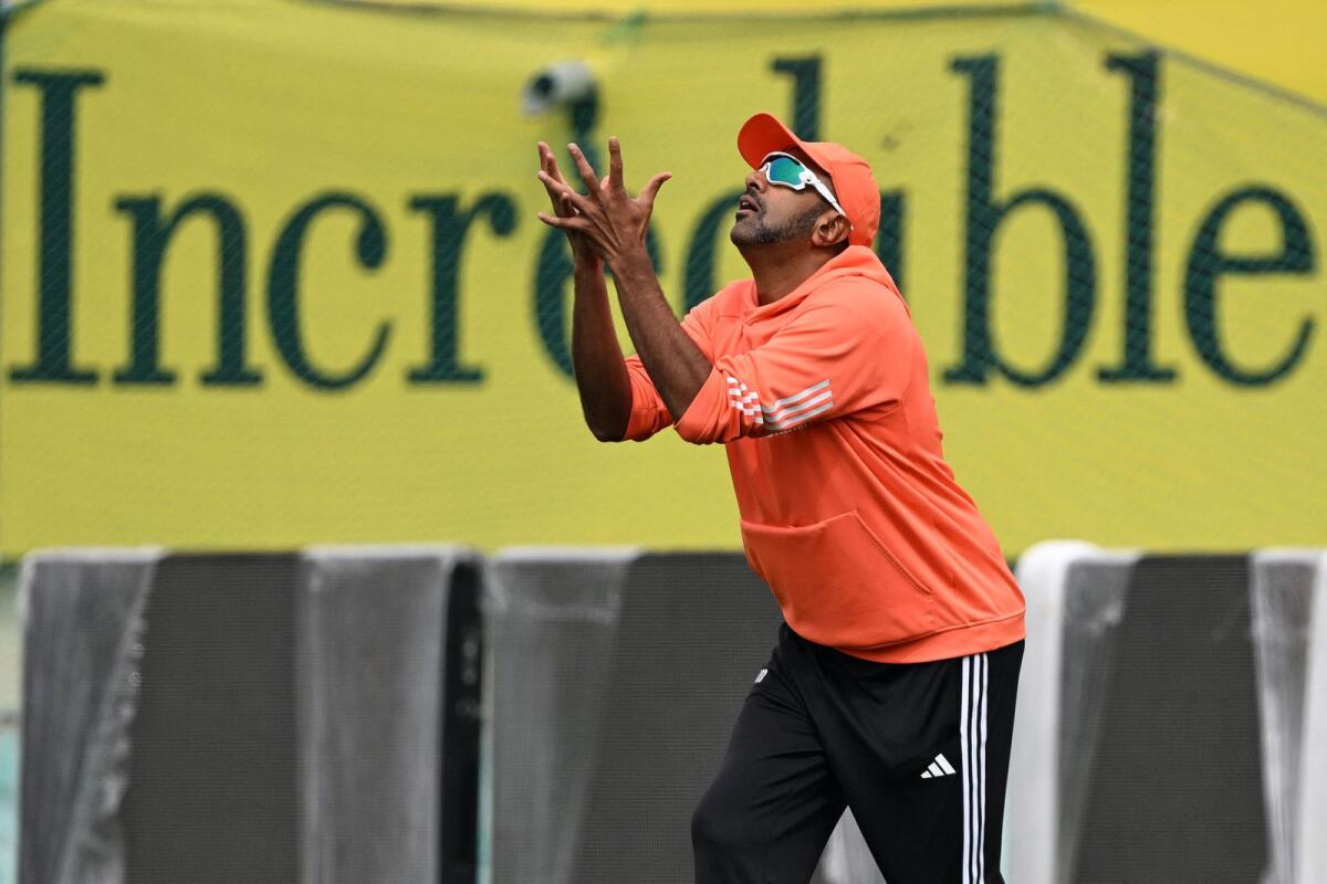 India's Ravichandran Ashwin prepares to take a catch during a practice session in Dharamshala on Tuesday. — AFP