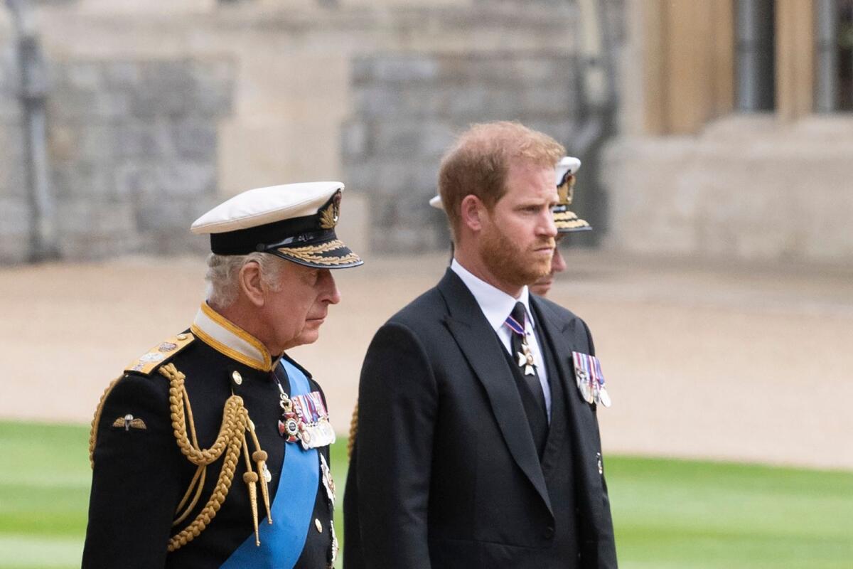 FILE Britain's King Charles III (L) walks with his son Britain's Prince Harry, Duke of Sussex. Photo: AFP
