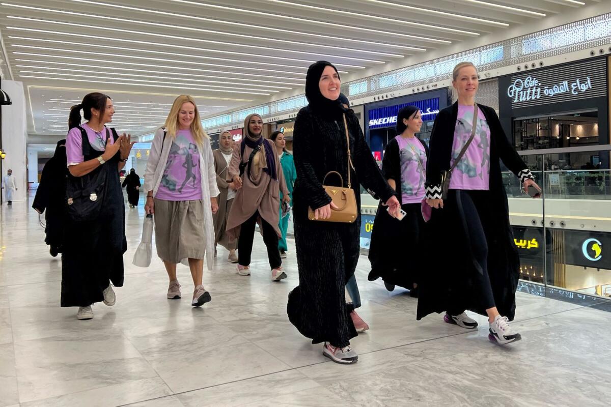 Saudi women walk in a mall in Riyadh on October 15, 2023. – AFP