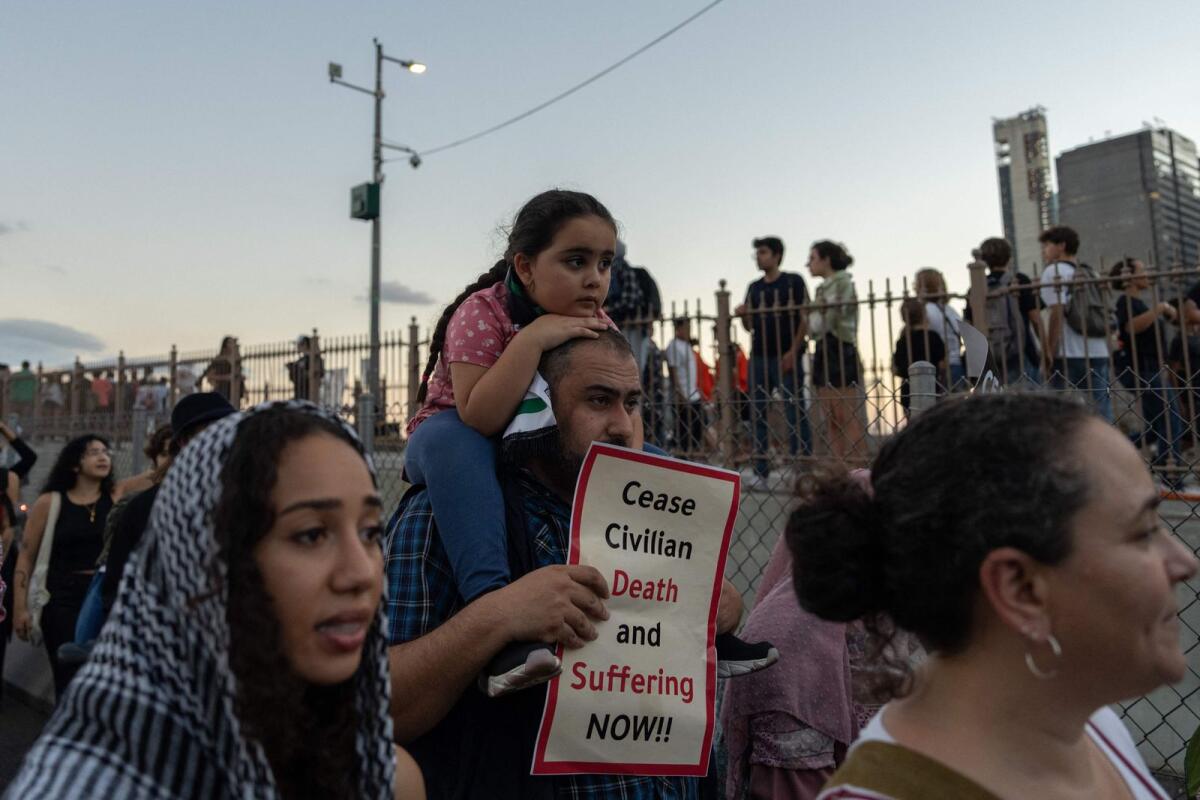 People cross the Brooklyn Bridge as they take part in a protest in support of the Palestinian people in New York on October 28, 2023. Photo: AFP