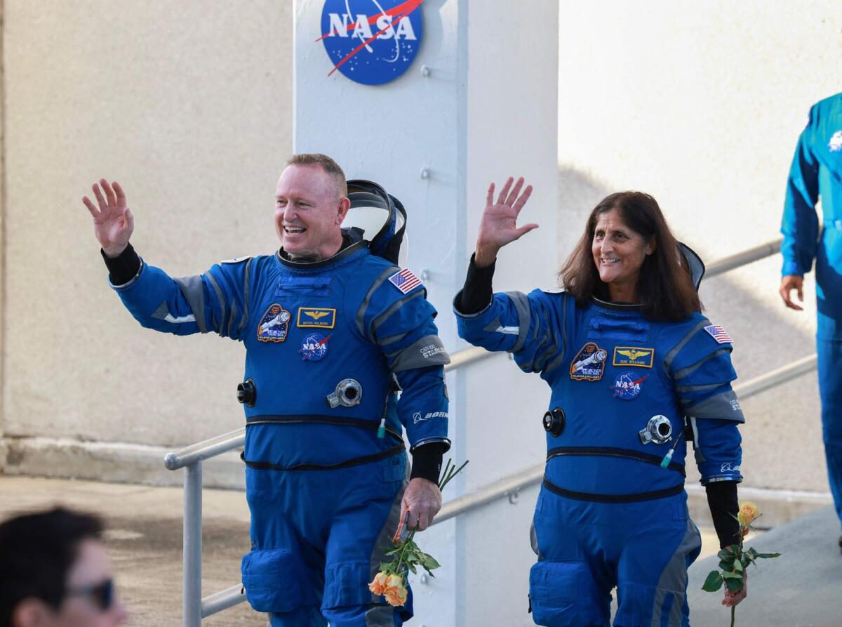 Nasa’s Boeing Crew Flight Test Commander Butch Wilmore (L) and Pilot Suni Williams walk out of the Operations and Checkout Building on Wednesdat in Cape Canaveral, Florida. — AFP