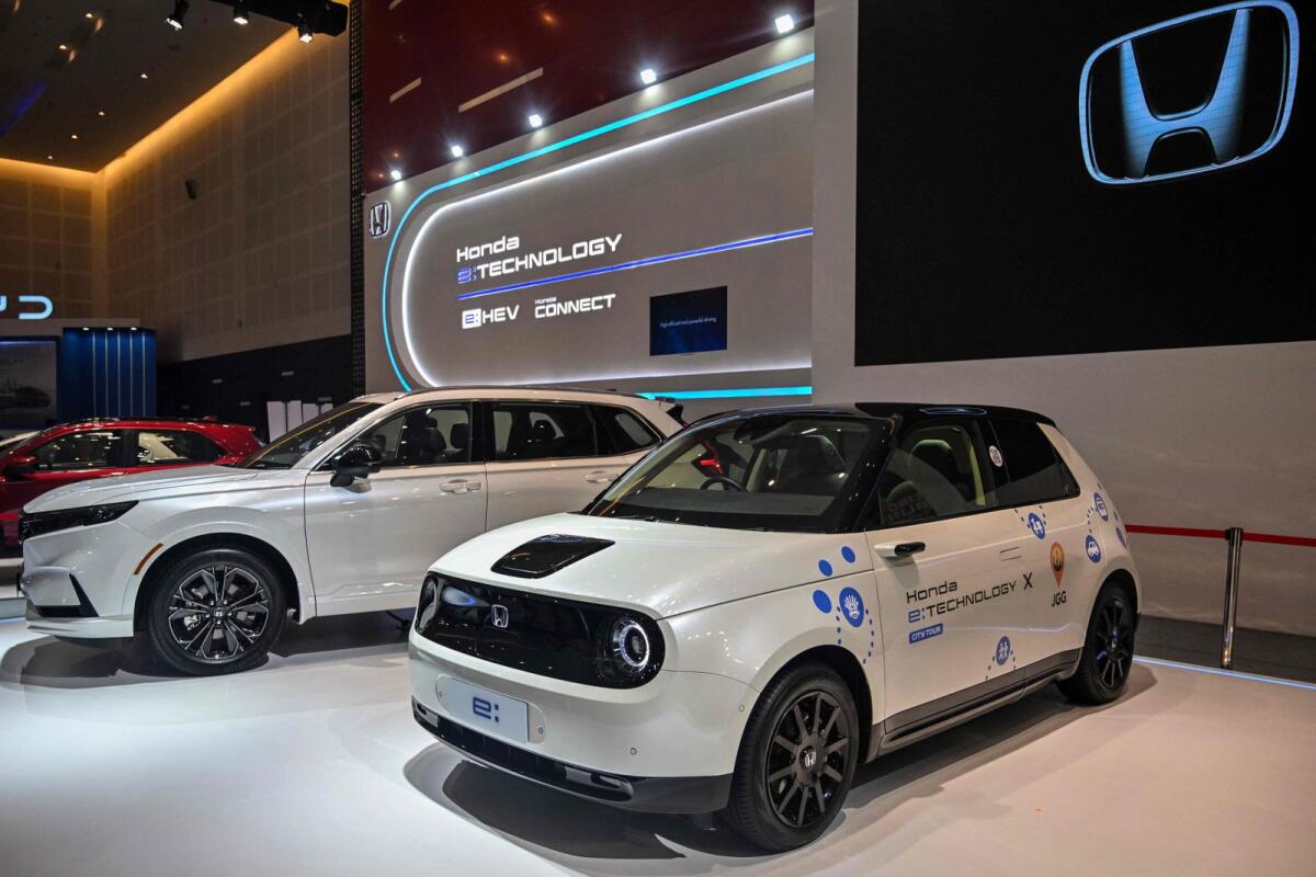 Japanese automobile manufacturer Honda displays its 'e' electric vehicle during the Indonesia International Motor Show (IIMS) in Surabaya on May 29, 2024. -- AFP