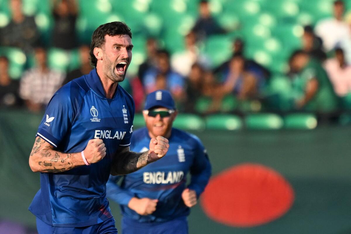 England's Reece Topley celebrates after taking the wicket of Bangladesh's Mushfiqur Rahim. — AFP