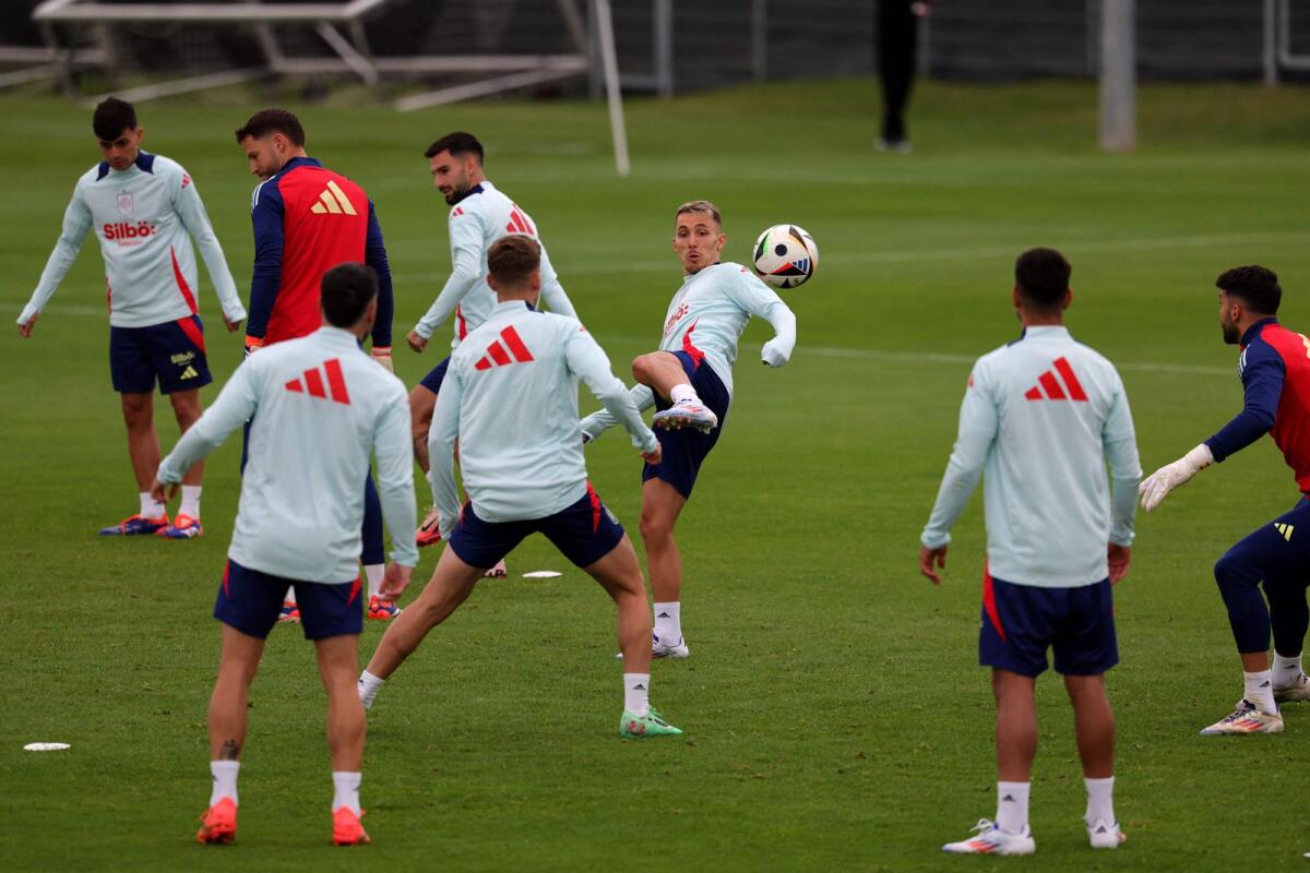 Spain defender Alejandro Grimaldo (centre) attend a training session. — AFP