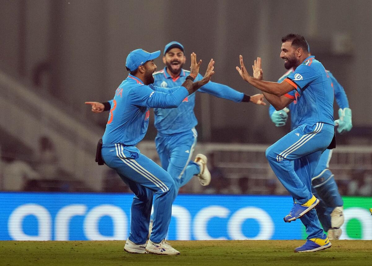 India's Mohammed Shami with teammates celebrates the wicket of England's Jonny Bairstow during the ICC Men's Cricket World Cup 2023 match between India and England. Photo: PTI
