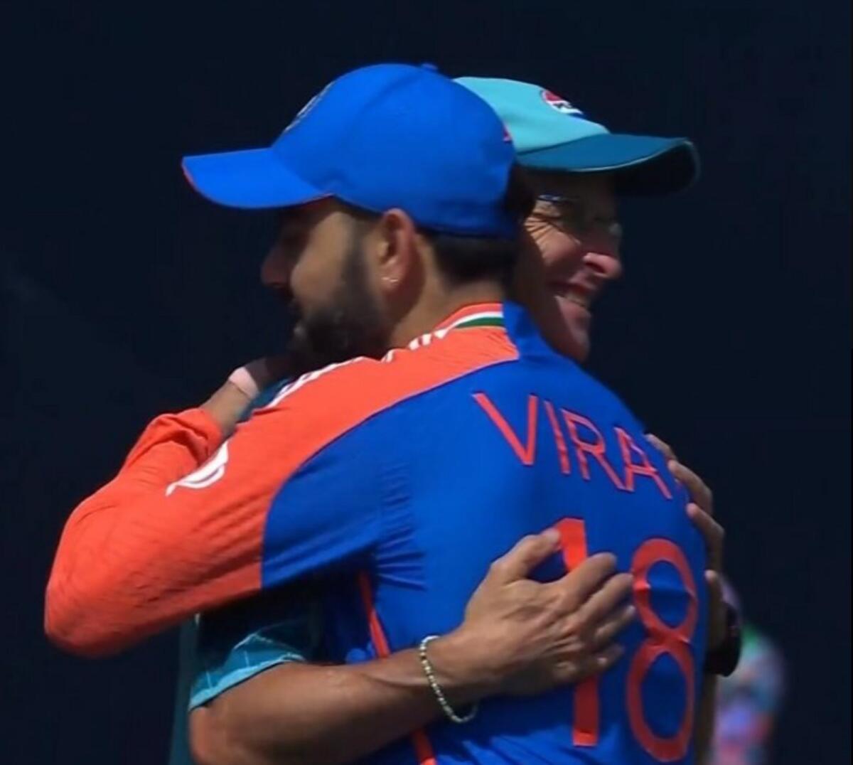 Pakistan coach Gary Kirsten hugs Indian star Virat Kohli after the match. — X