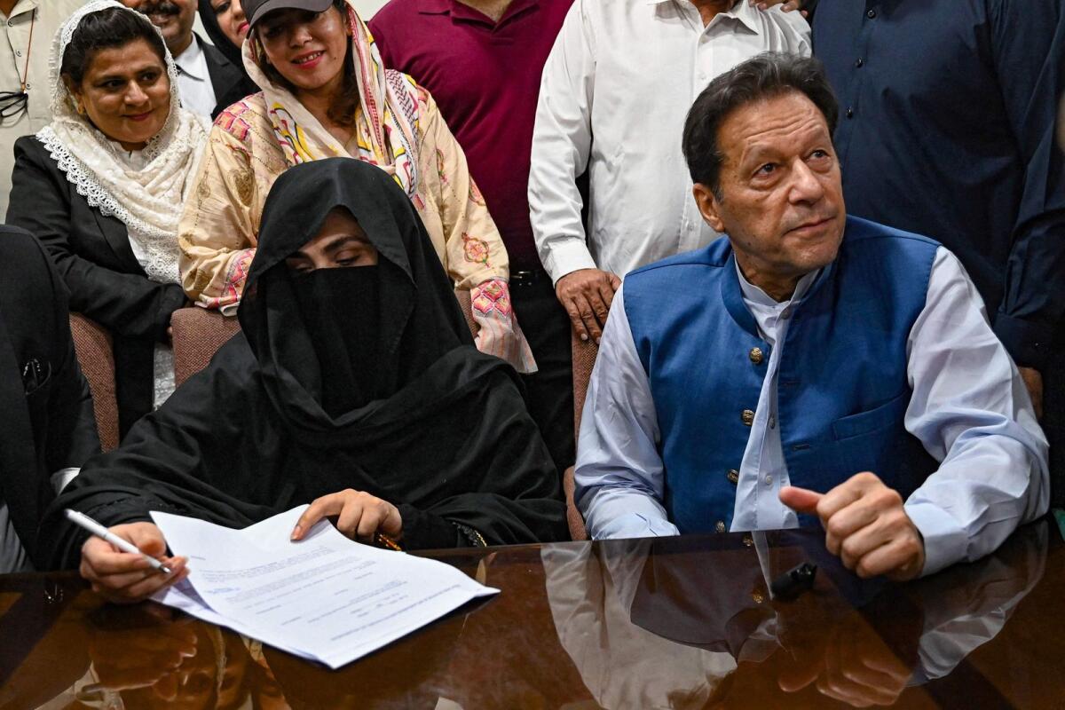Imran Khan and his wife Bushra Bibi in Lahore High Court  on July 17, 2023. — AFP file