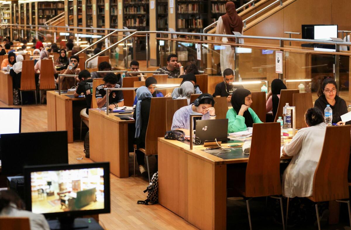 Students study for their high school certificate exams at the Library of Alexandria during the power-off time that the government applied to overcome the overload amid a heatwave. — Reuters