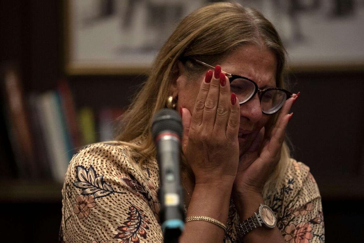 A relative of an Israeli missing since a surprise attack by Hamas militants near the Gaza border, is overcome by emotion during a press conference in Ramat Gan, Israel, Sunday, Oct. 8, 2023. Photo: AP