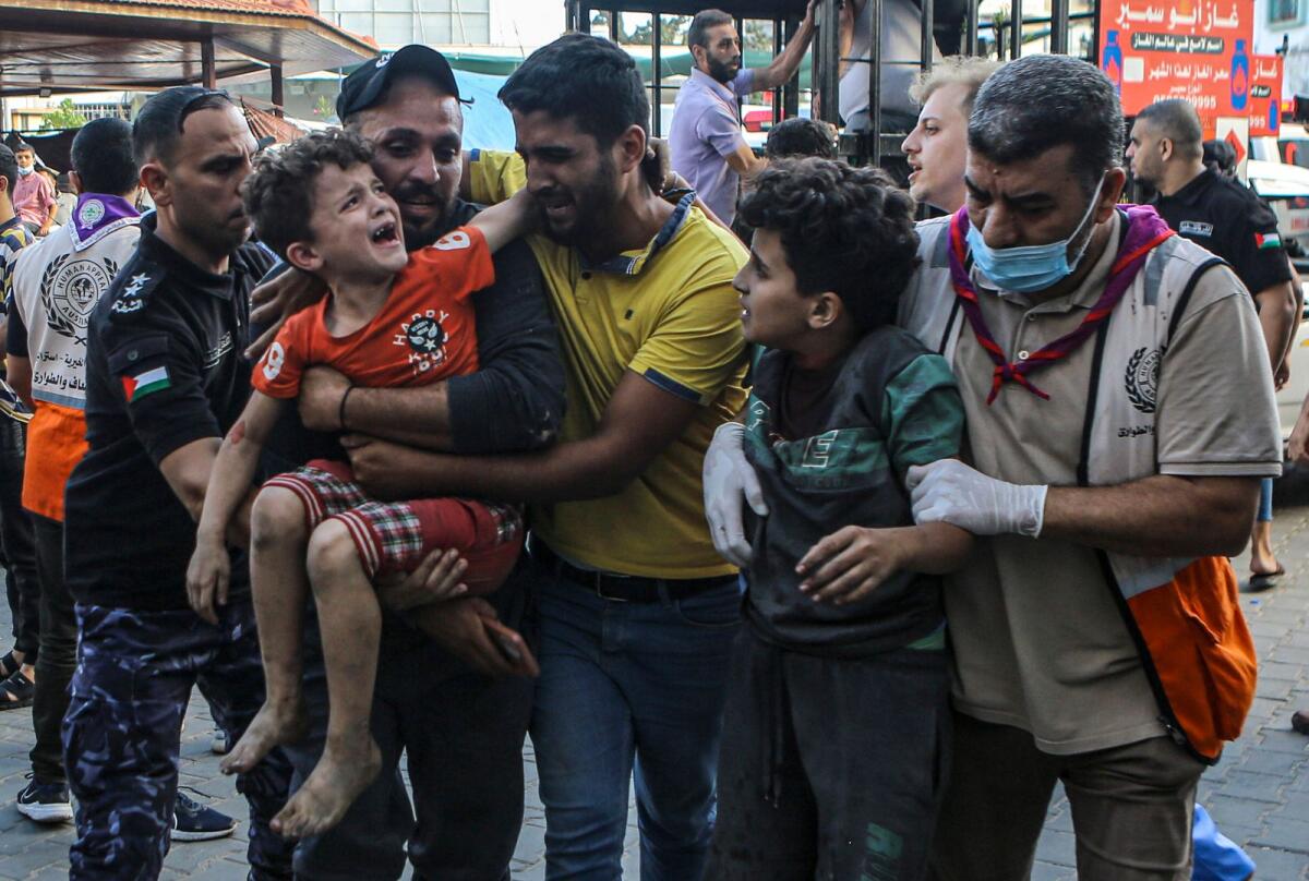 Wounded Palestinian children arrive to Al Shifa hospital, following Israeli airstrikes on Gaza City. — AP