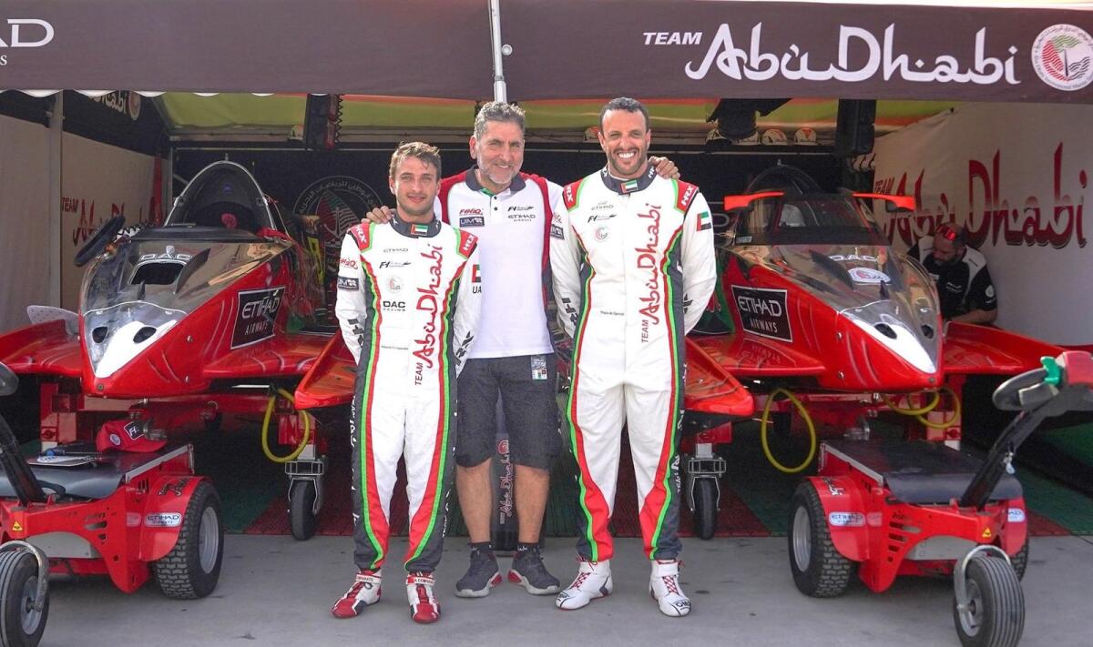 Team Abu Dhabi manager Guido Cappellini with Thani Al Qemzi and Alberto Comparato. - Supplied photo