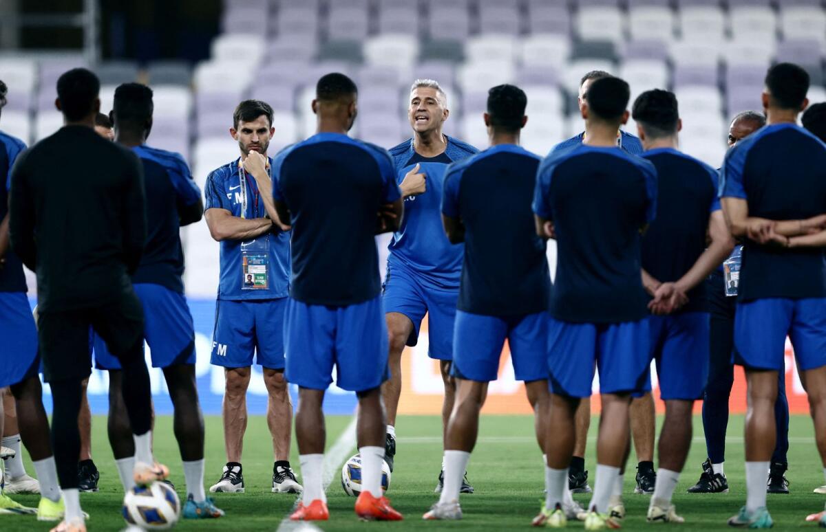 Al Ain coach Hernan Crespo with players in a huddle during training. Photo: Reuters