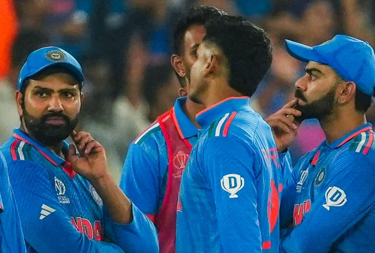 India's Rohit Sharma, Virat Kohli and other players after the final match. — PTI