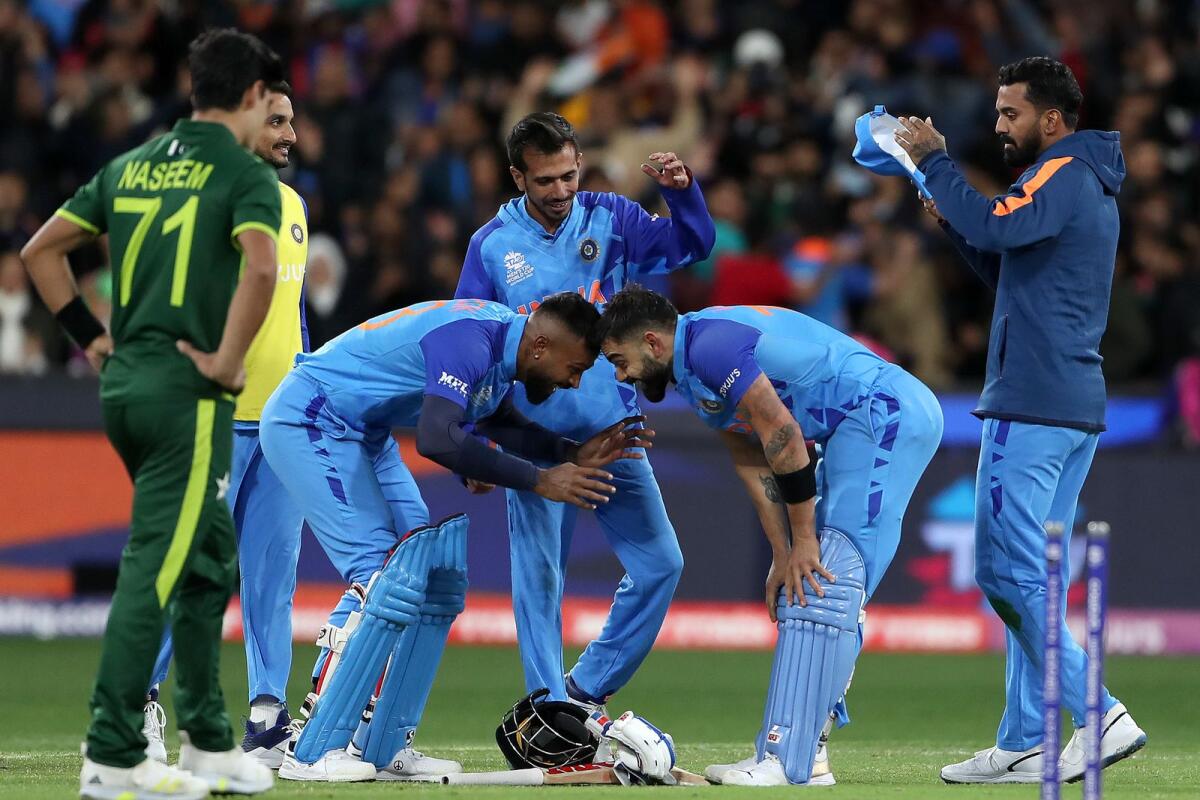 India's Virat Kohli (right) and Hardik Pandya celebrate their win in the last-ball thriller against Pakistan at the Melbourne Cricket Ground. (AFP)