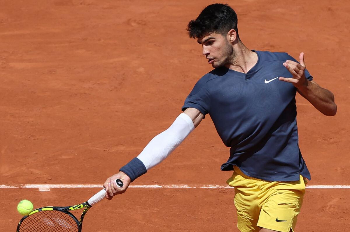 Spain's Carlos Alcaraz plays a forehand return to Jeffrey John Wolf of the US during their match at the French Open. — AFP