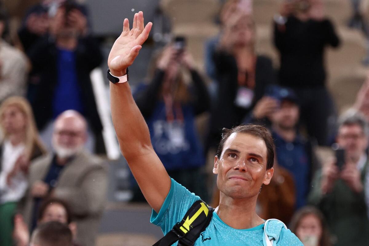 Rafael Nadal waves to the crowd as he leaves the court after losing his first round matc against Alexander Zverev. — AFP